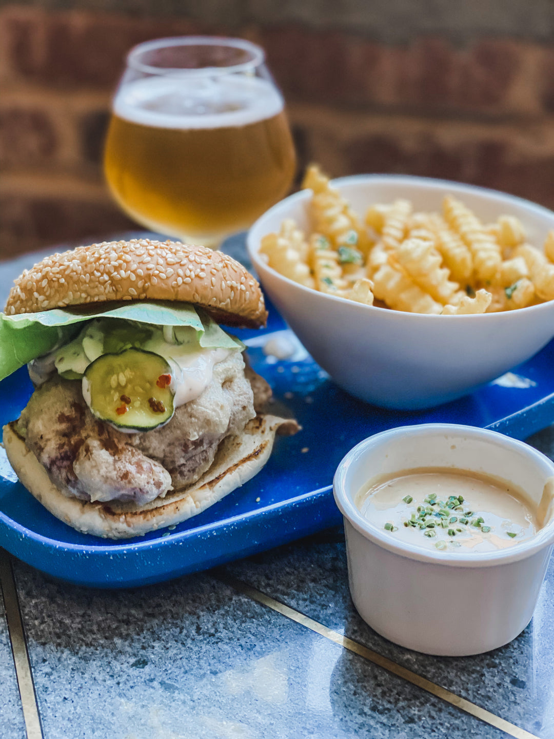 Chicken sandwich, fries, and a beer at Selvedge