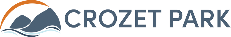 Logo of Crozet Park with a mountain and water design.